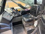 a black seat in the driver ' s seat of a tractor