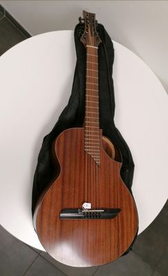 a guitar that is sitting on a white table