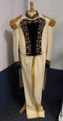 a mannequin in the corner of a room with a dress on it