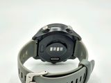 a close up of a watch on a white surface