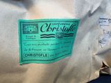 a green label on a bag of coffee on a table