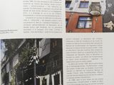 an open book with a picture of a building in the middle of it