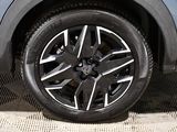 a close up view of a car ' s wheel on the ground
