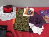 a red table with many items on it and a black bag