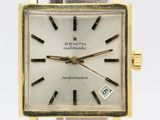 a close up of a wrist watch with a brown leather strap
