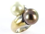 an image of a close up of a ring with two pearls on it