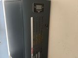 a metal cabinet in the corner of a room with a door open