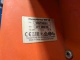 a label on the side of a machine that is sitting on a table
