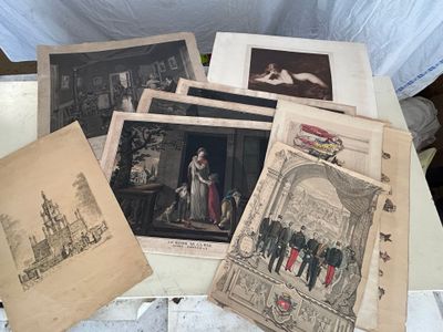 a lot of old pictures on the table