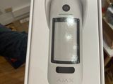 someone is holding a box with a remote control inside of it