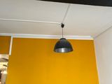a couch and a table in a room with a yellow wall