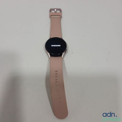 a close up of a samsung watch on a white surface