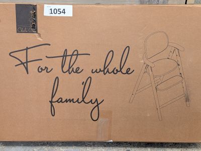 a cardboard box with a drawing of a baby in a highchair