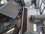 a pile of electronic equipment in a metal basket