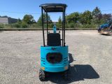 an image of a small blue machine parked in a parking lot