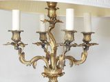 a lamp that is sitting on a table next to a lamp