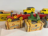 many different types of toy cars on a table