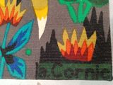 a picture of a rug with a bird and flowers on it