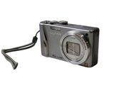 a silver camera with a strap attached to it