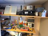 a shelf that has a lot of stuff on it