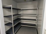 a room with shelves and shelves in it that are empty