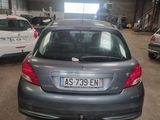 a car that is parked in a garage with other cars