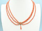 a close up of a necklace on a mannequin mannequin