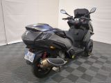 a motorcycle that is parked on a checkered floor