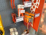 a display of various tools on the wall in a store