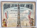 a sign that says grand jeu du bebe jumeau with a picture of the eiffel tower in the background