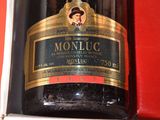 a bottle of wine that is sitting on a shelf