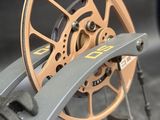 a close up of a bike wheel with a wren on it