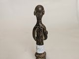 an image of a figurine of a man in a black and white outfit