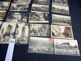 several old black and white photographs of people and buildings on a table