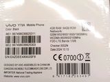the back of a white cell phone with a barcode on it