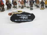 a lot of figurines that are on a table