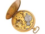 a gold pocket watch that is open on a white background