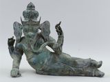 bronze statue of the hindu god sitting on the back of an elephant