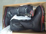 a box with a pair of motorcycle boots in it