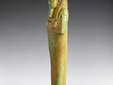 an egyptian statue of a woman holding a bird