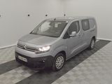 the silver van is parked in a clean room with checkered flooring