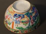 a vase with a colorful design on it on a table