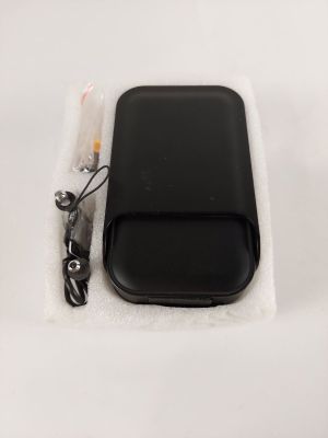 a black cell phone sitting on top of a white cloth