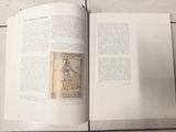 an open book with a drawing of a man on it