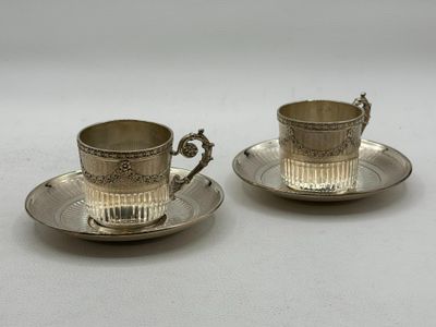 pair of silver plated cups and saucers