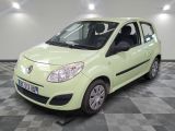 a picture of a small green car parked on a checkered floor