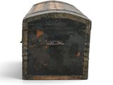 an old trunk that is sitting on a white surface