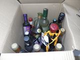 a cardboard box filled with bottles of wine and liquor