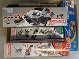 three boxes of legos sitting on the floor