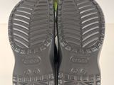 the soles of a pair of gray shoes on a white surface